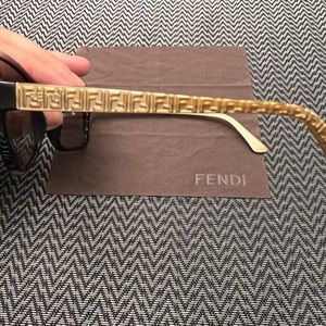 Fendi sunglasses in brown and gold.